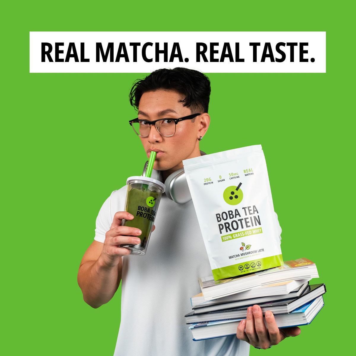 Woman holding Boba Tea Protein packaging and a green drink against a green background with text 'Real Matcha. Real Taste.'