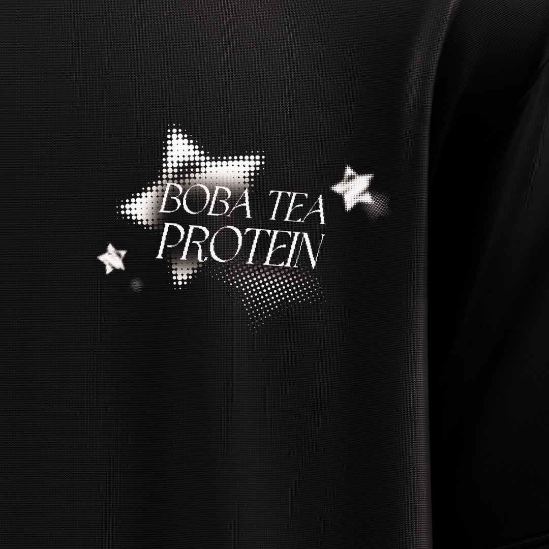 Black shirt with 'Boba Tea Protein' text and star designs on a dark background