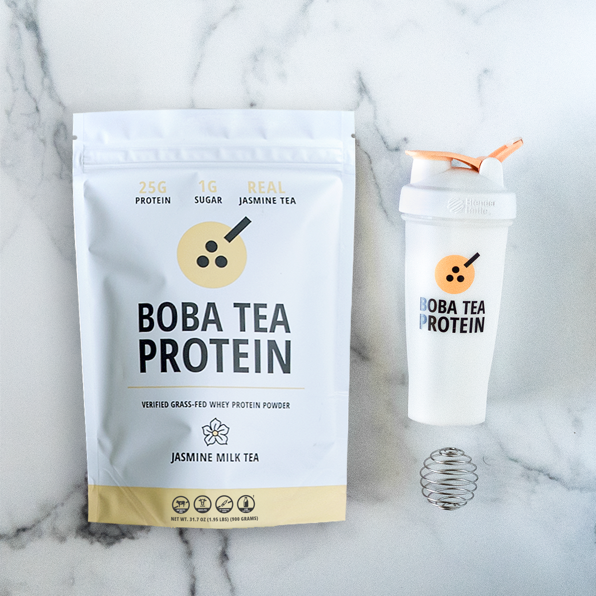 Boba Tea Protein packaging with a shaker bottle on a marble background