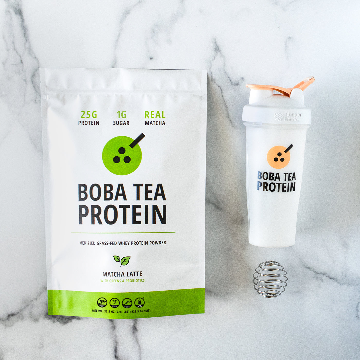 Boba Tea Protein packaging with a shaker bottle on a marble background