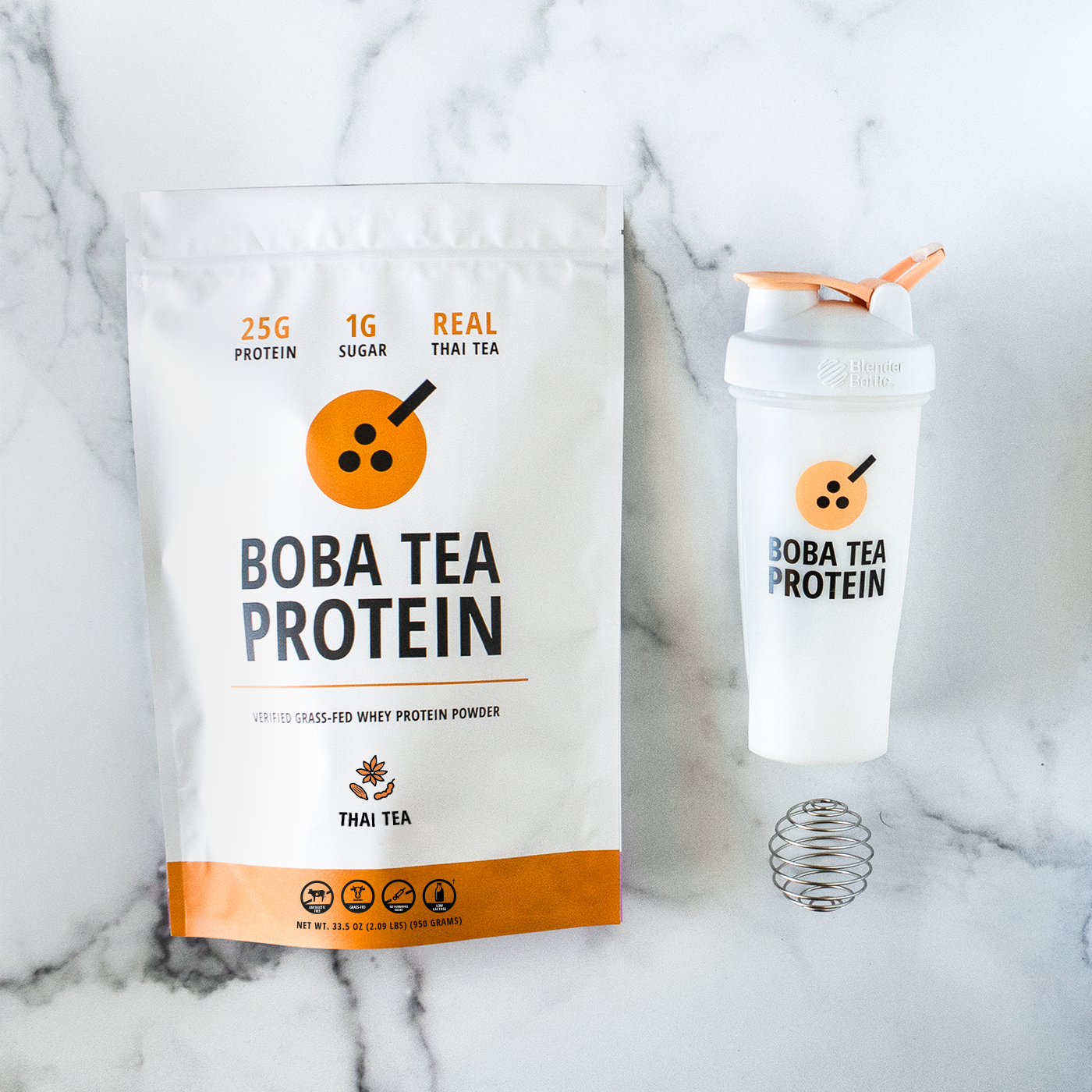 Boba Tea Protein packaging with a shaker bottle on a marble background