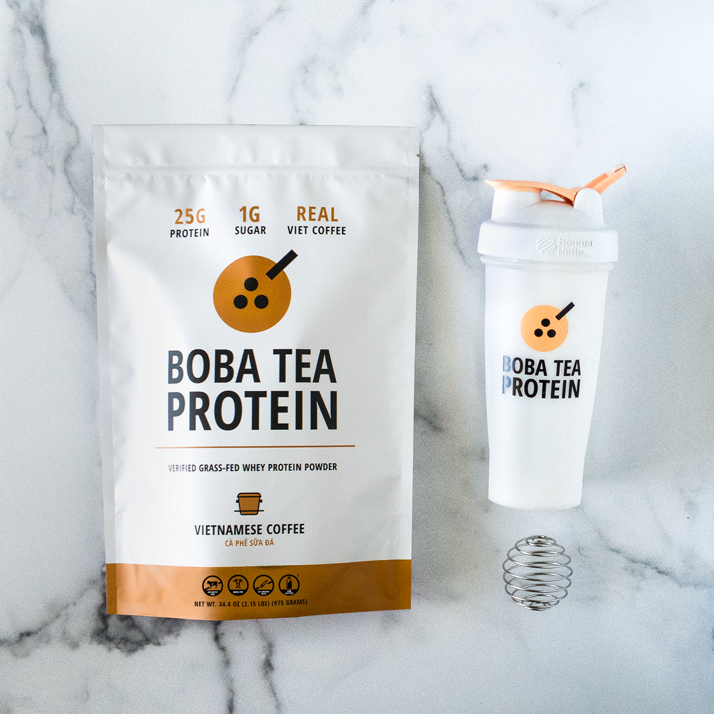 Boba Tea Protein packaging with a shaker bottle on a marble background