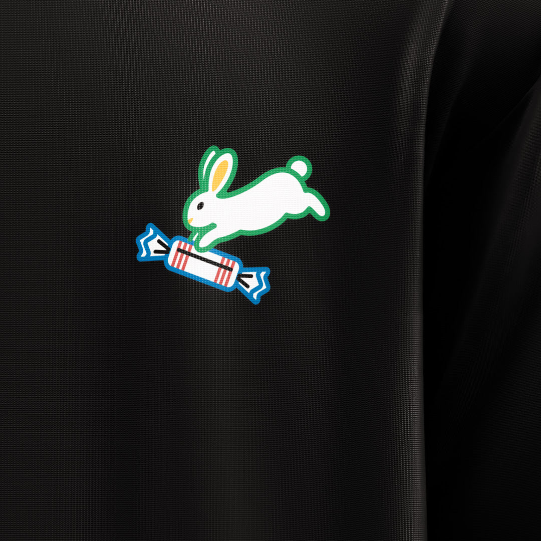 Printed logo of a rabbit with a blue candy on a black background