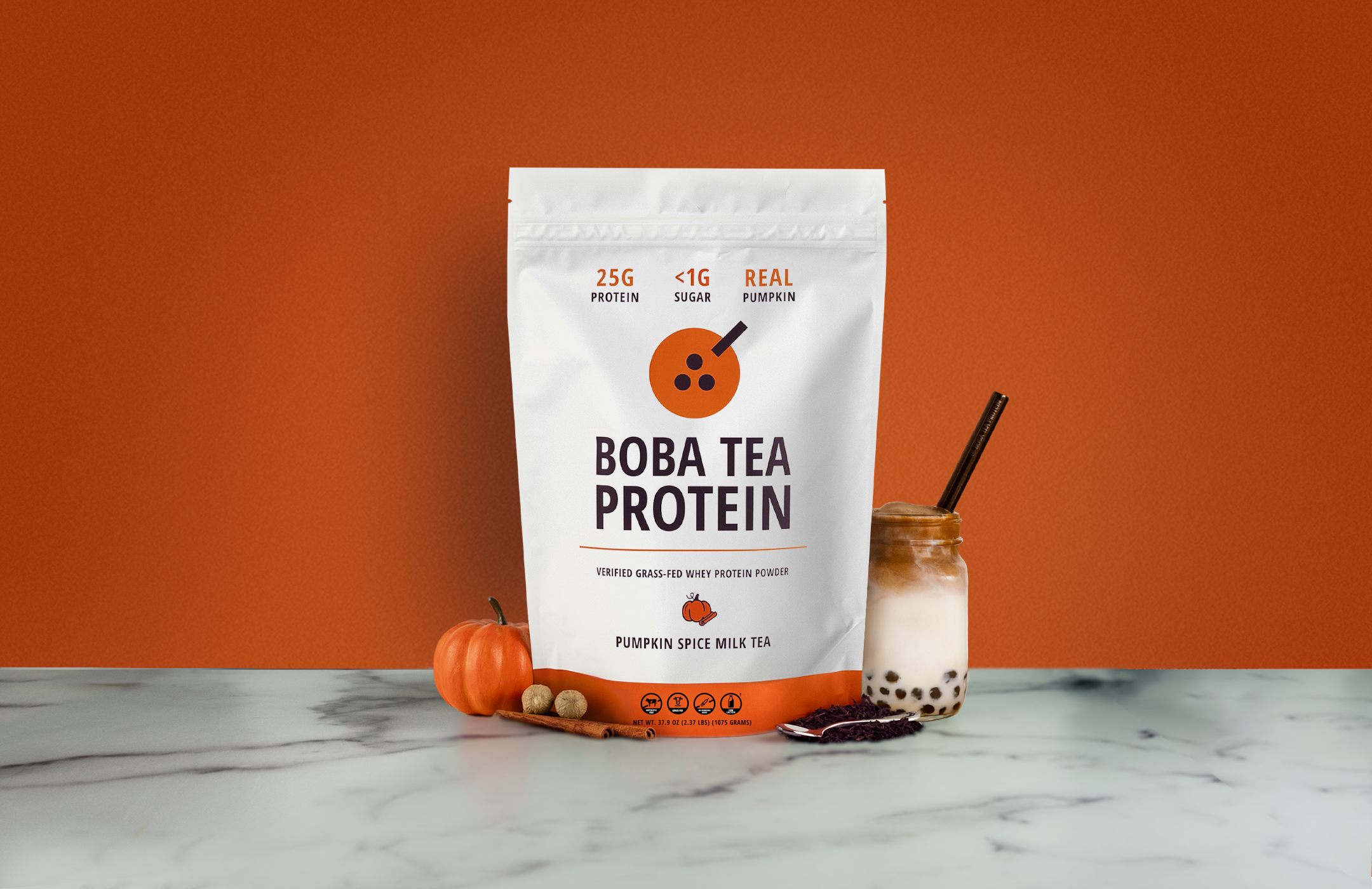 Boba Tea Protein package with a pumpkin spice milk tea on an orange background